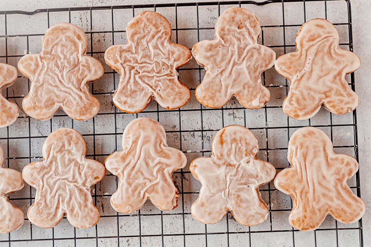 iced gingerbread man cookies setting on a wire rack