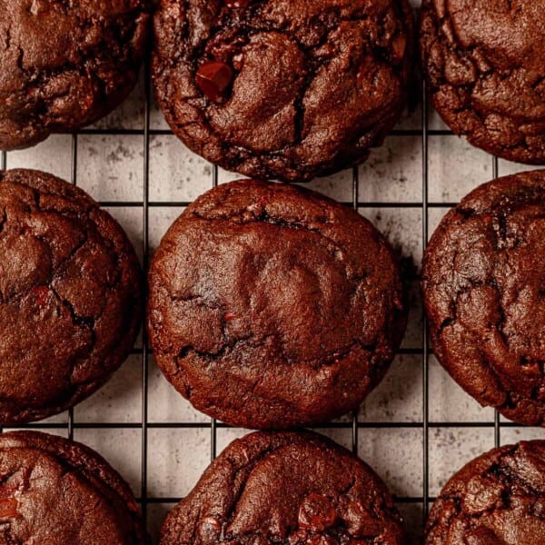 thick and chewy triple chocolate cookies on a cooling rack