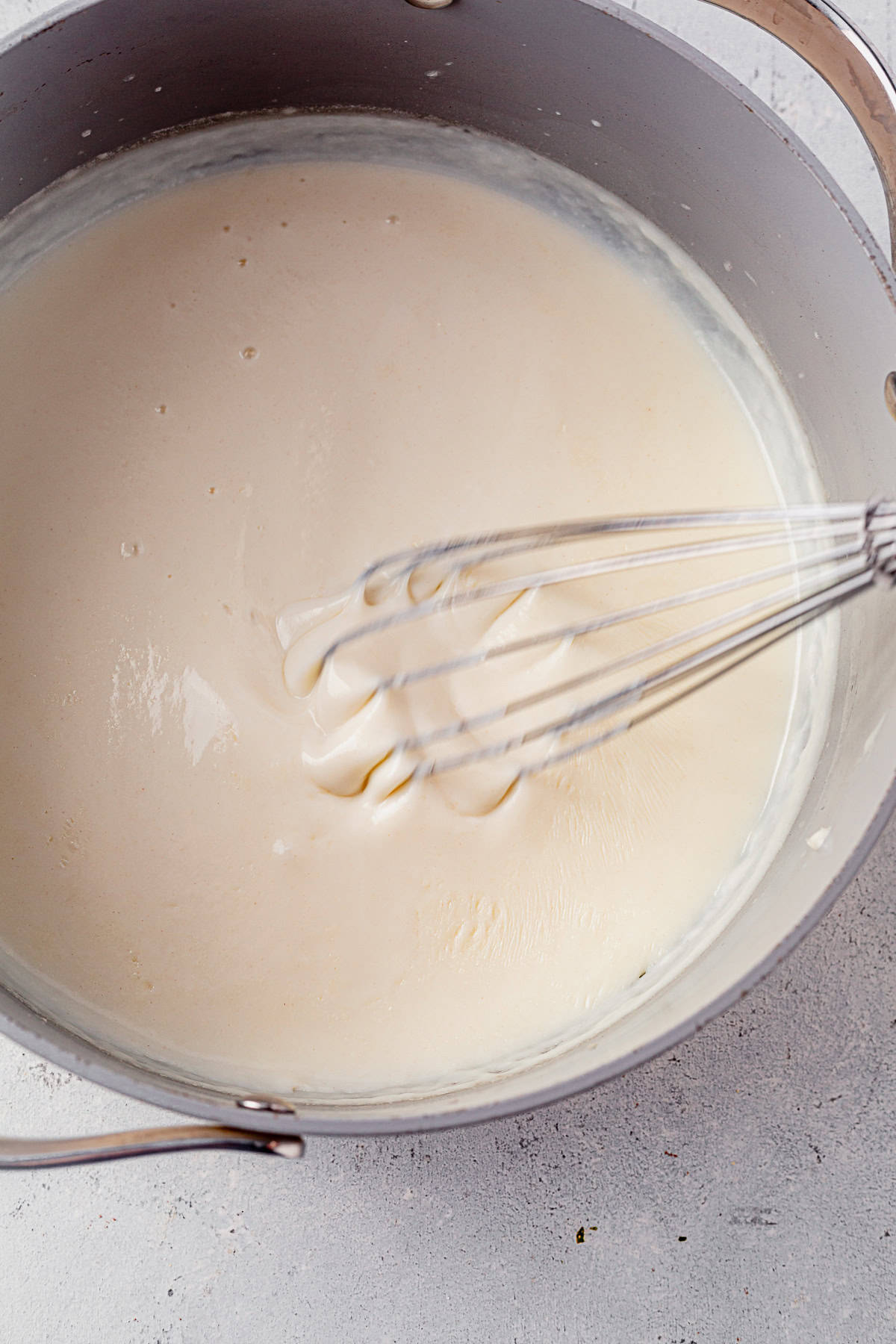 milk whisked into a roux