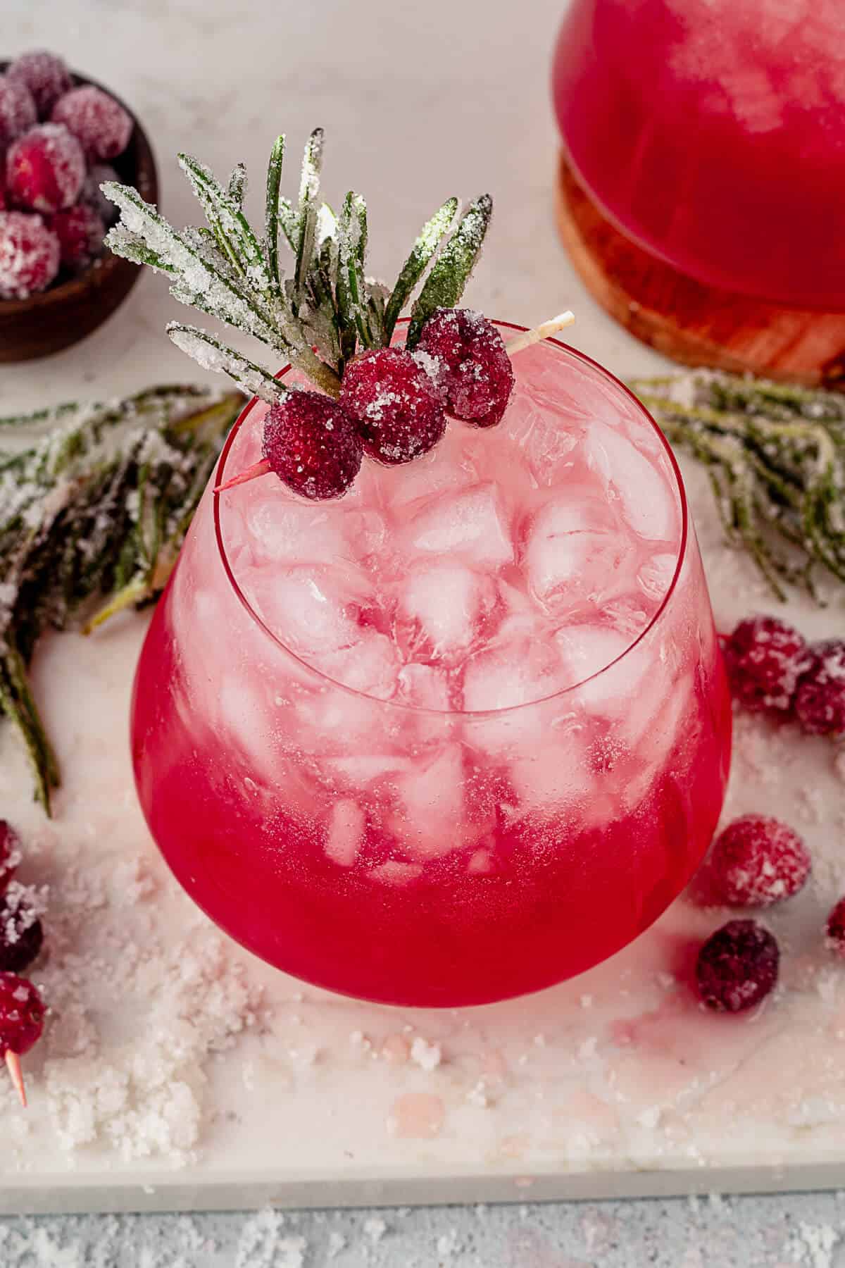 crushed ice in a christmas paloma with sugared cranberries