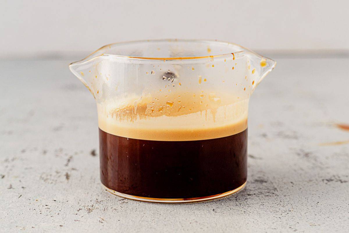 a double shot of espresso in a small glass