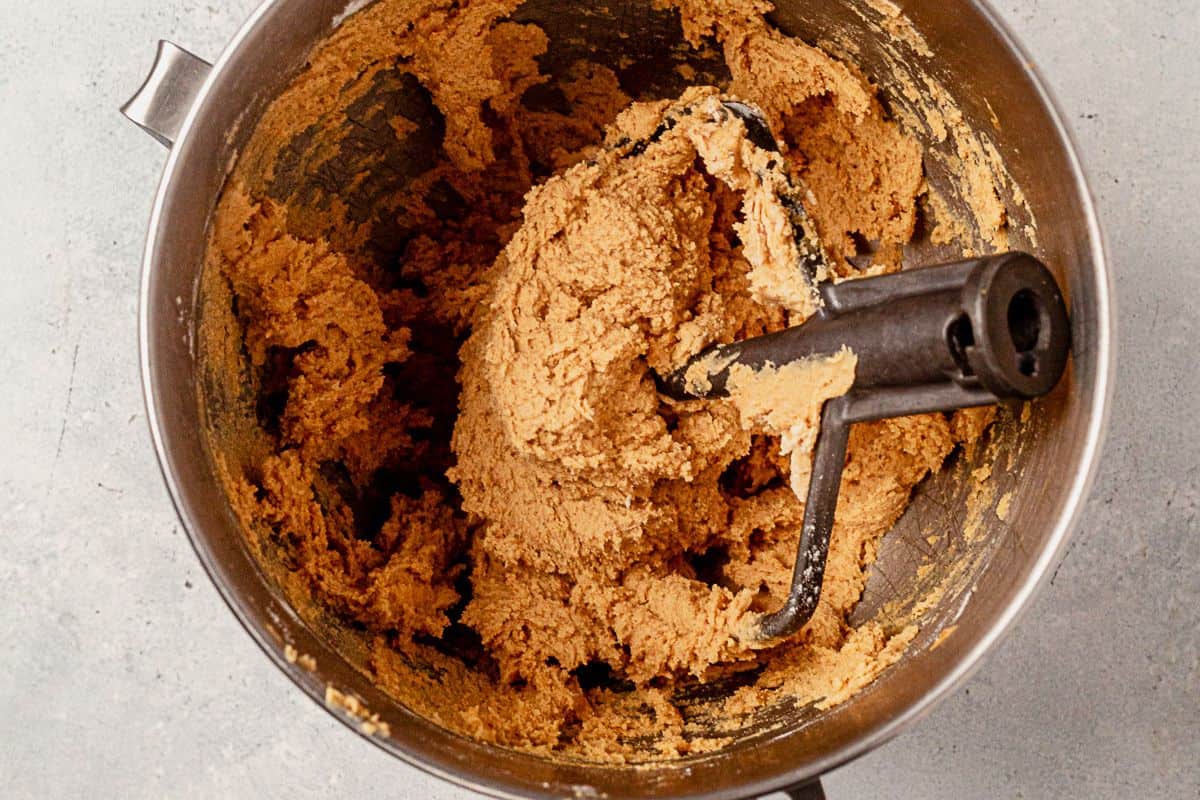 peanut butter cookie dough in a stand mixer with the paddle attachment