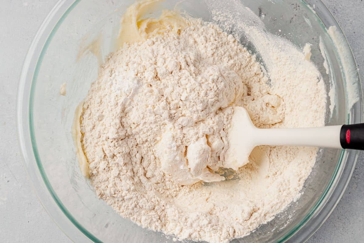 flour, cornstarch, flour, butter, and almond extract in a bowl