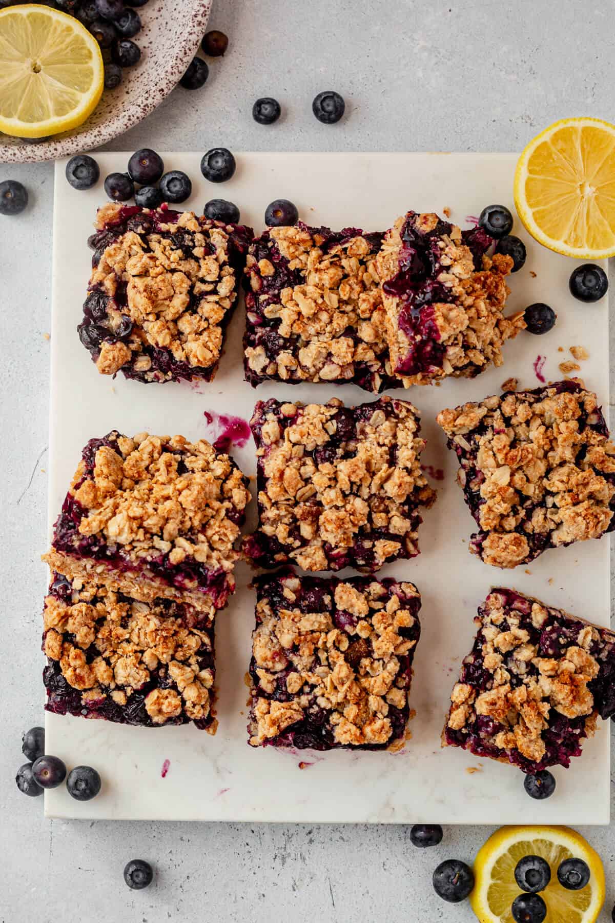 oatmeal crumb bars cut into squares on a countertop