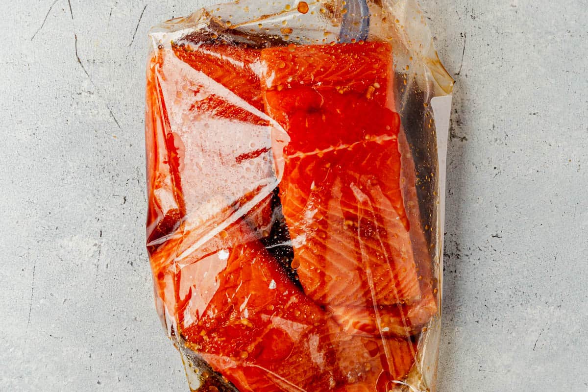 salmon filets marinating in honey sriracha sauce