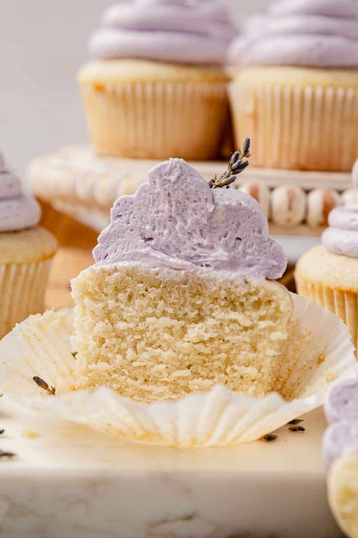 a frosted lavender cupcake cut in half