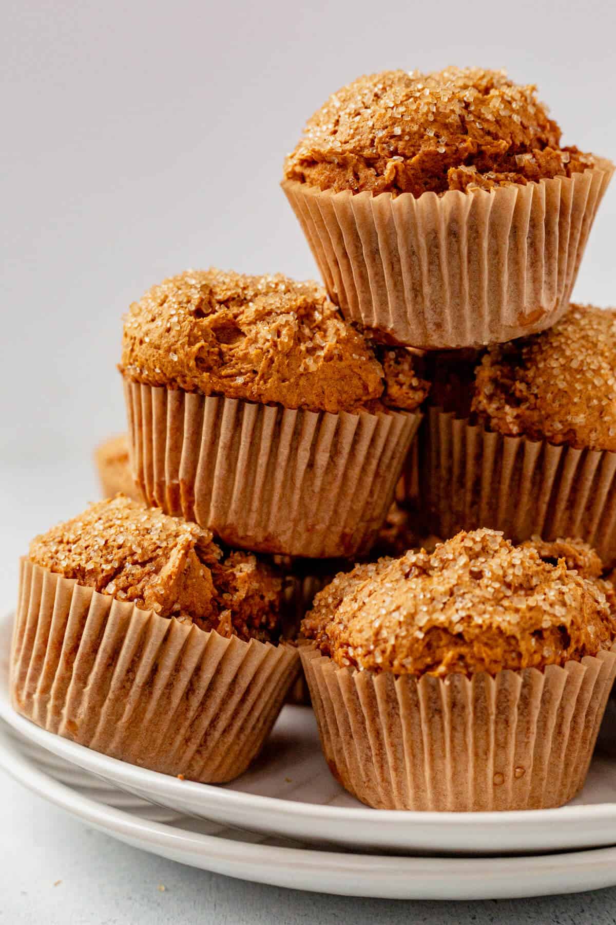 pumpkin muffins with cake mix baked and stacked on a plate