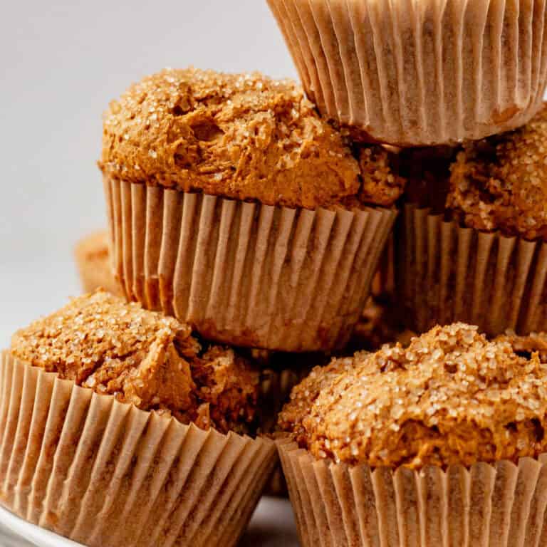 freshly baked pumpkin muffins in a pile on a plate