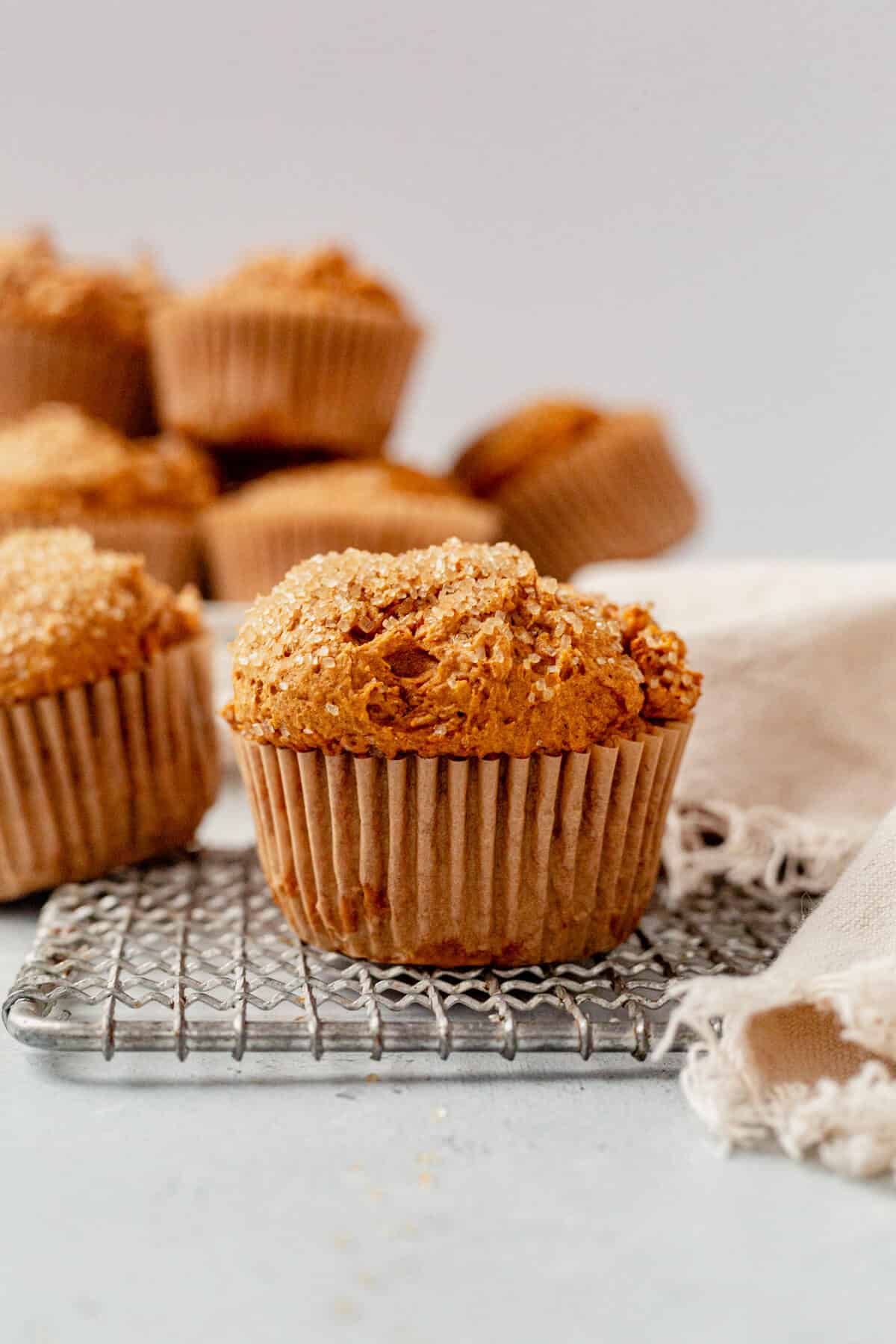 a pumpkin muffin with cake mix cooling on a wire rack