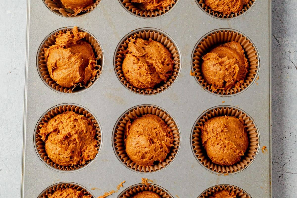 two ingredient pumpkin muffin batter in muffin tins