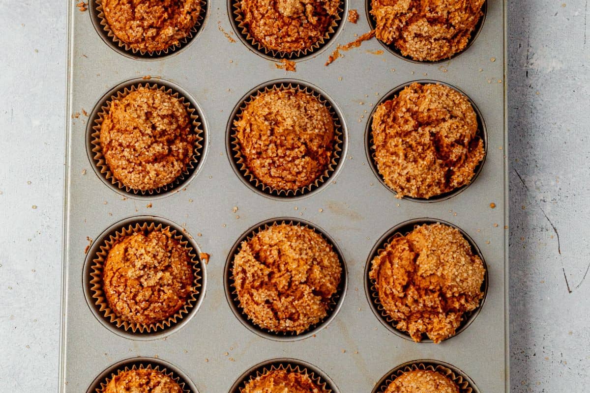 freshly baked pumpkin muffins with cake mix in muffin tins