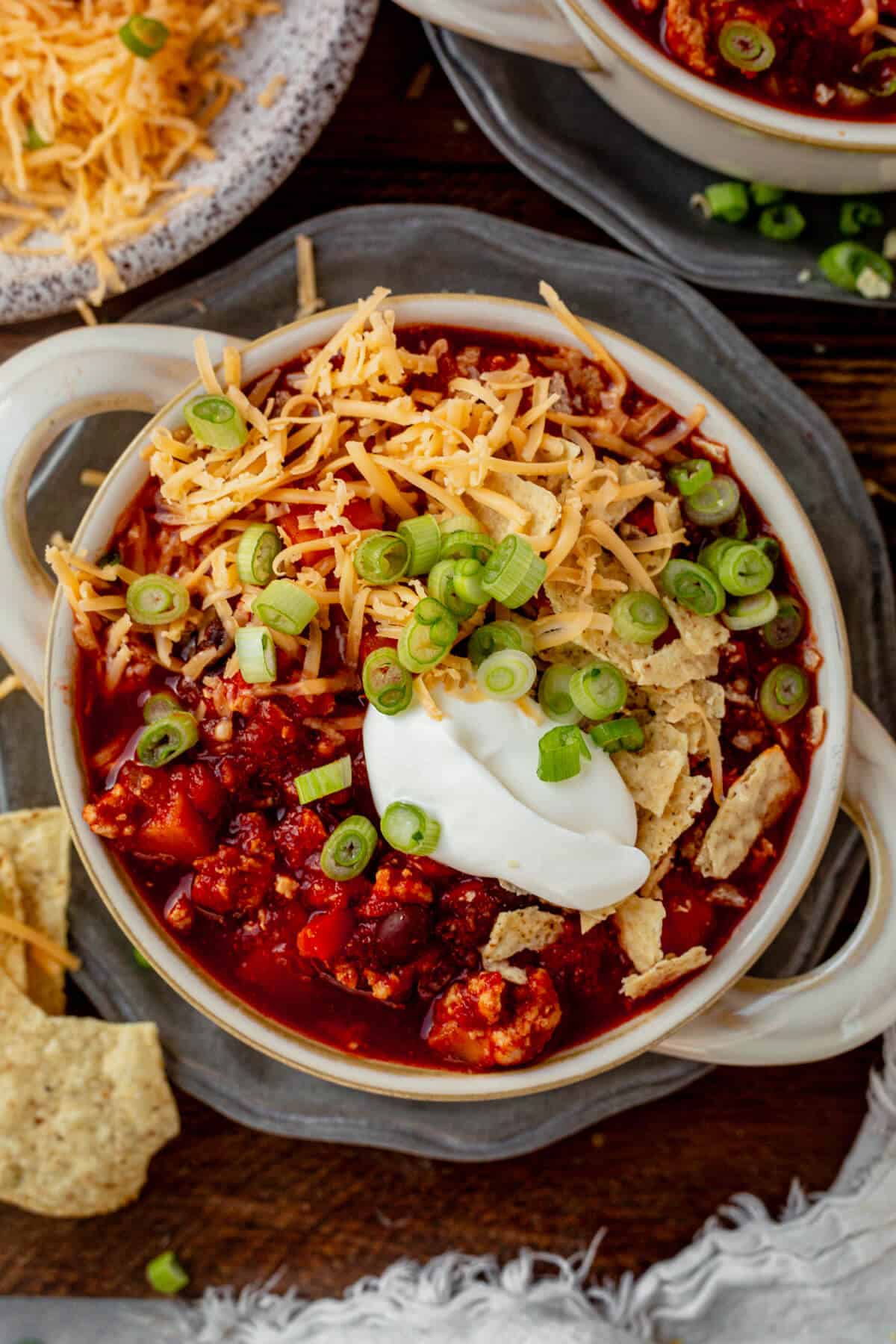 sweet potato chicken chili with cheese, sour cream, and green onions
