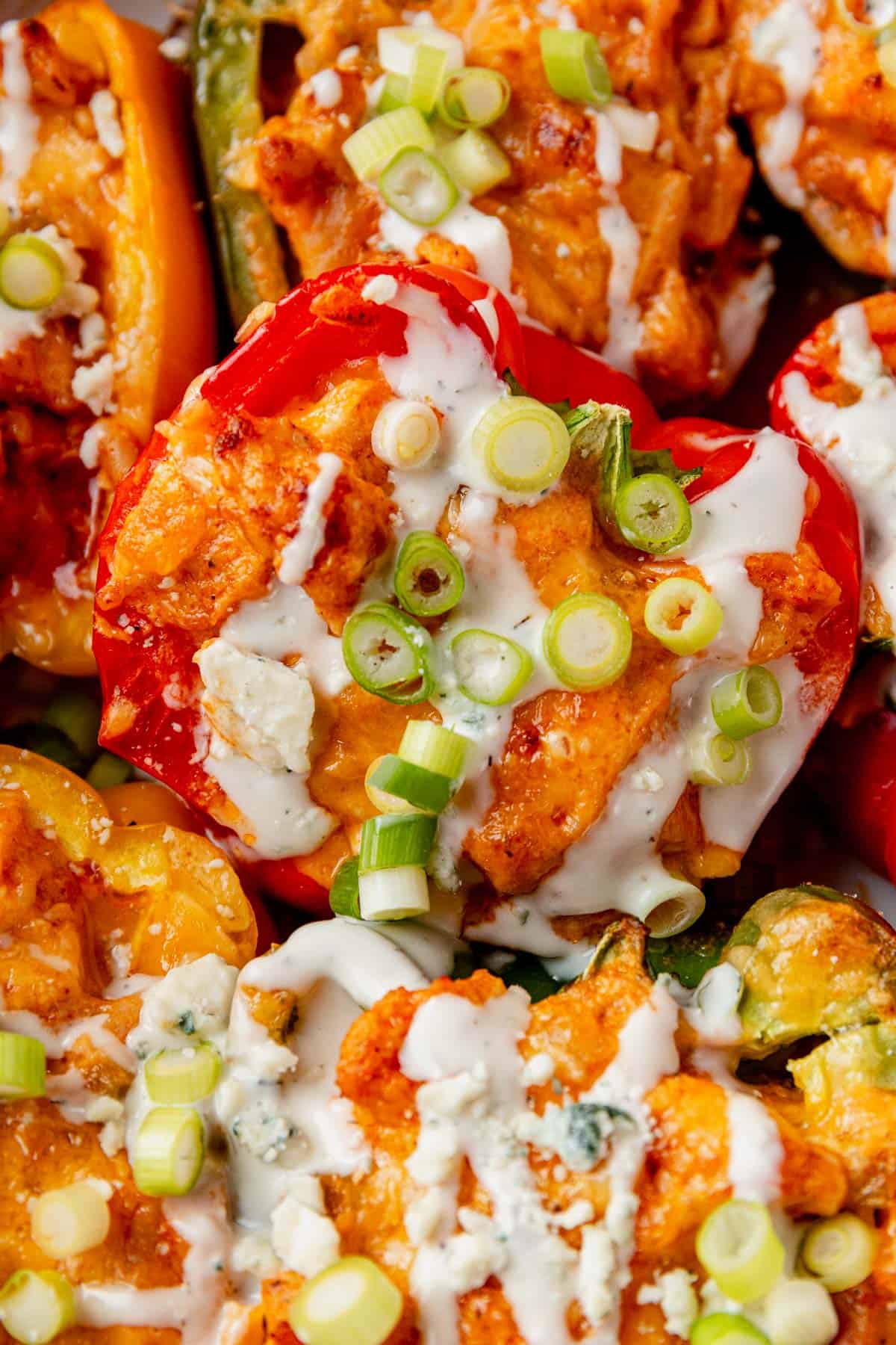 buffalo chicken stuffed peppers with ranch, blue cheese, and green onions