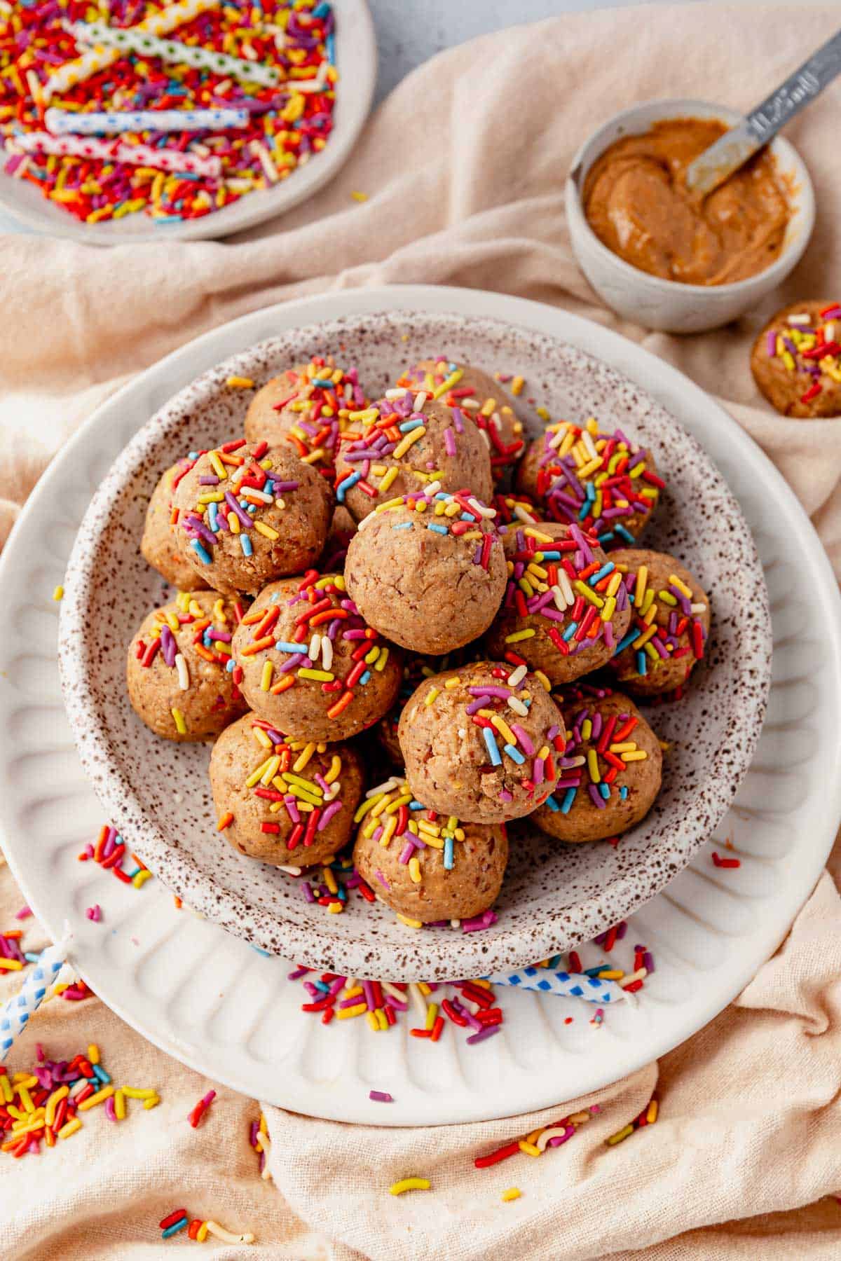 cake batter protein balls in a dish on the counter