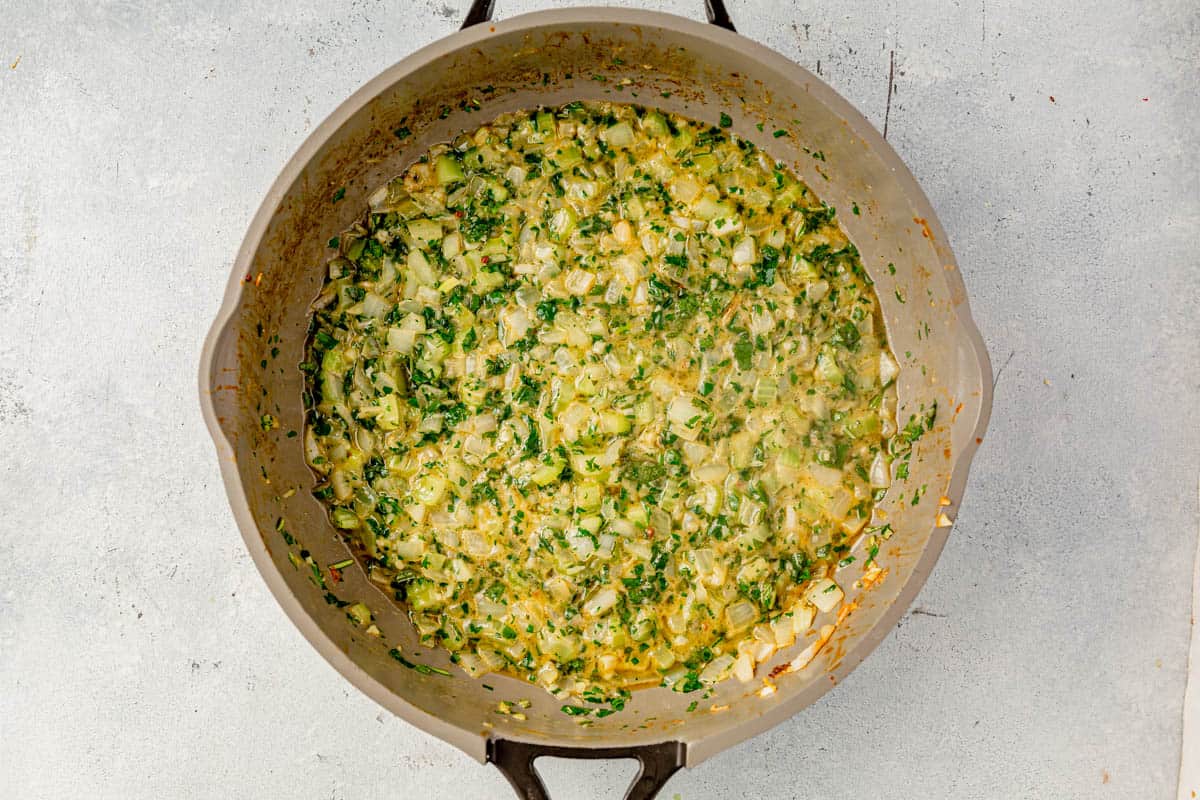 butter, thyme, rosemary, and parsley cooked in a pan