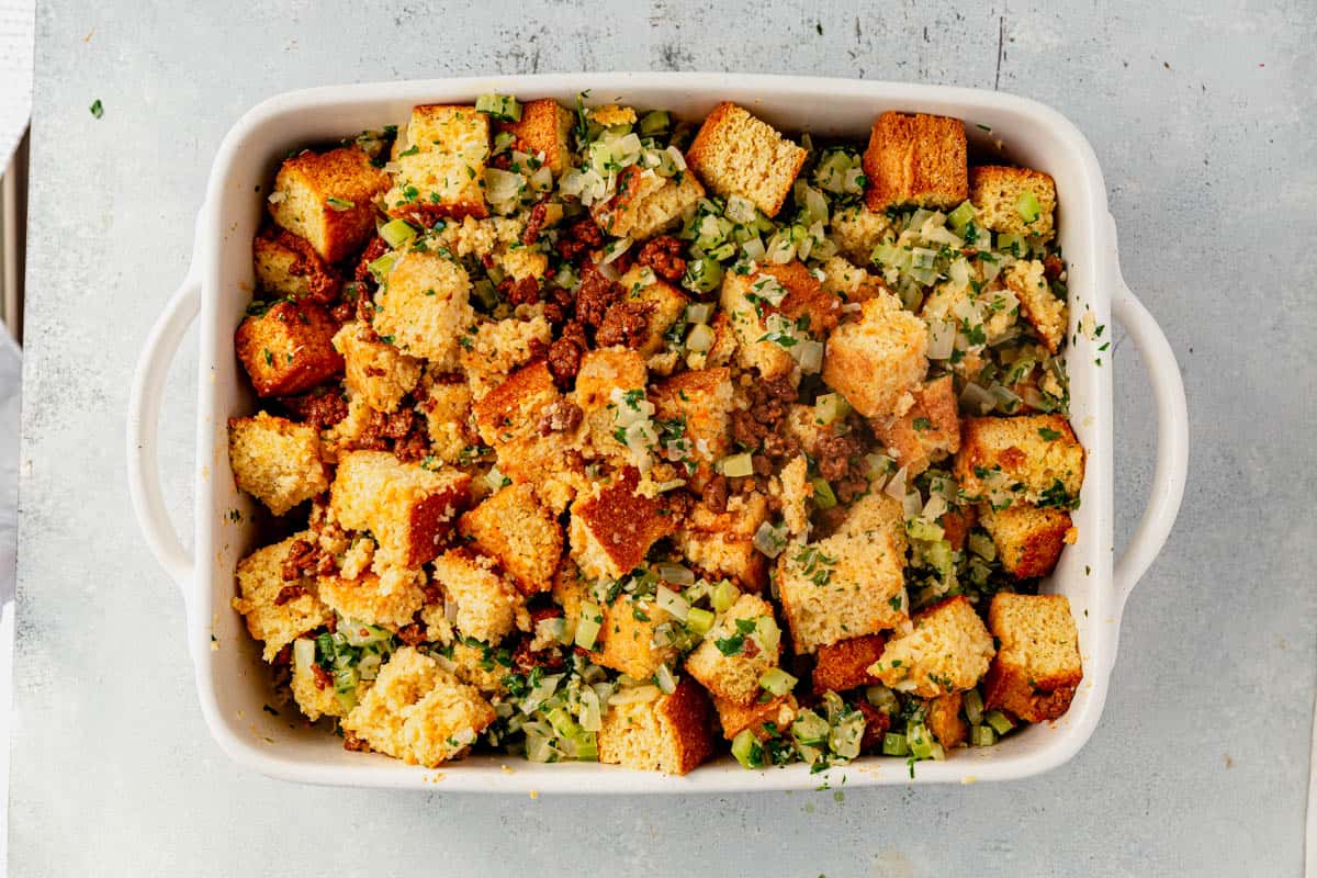 unbaked cornbread dressing in a casserole dish