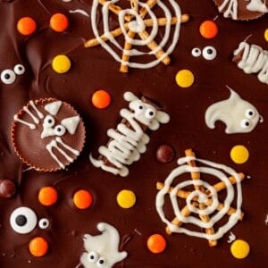 candy mummies, spider webs, ghosts, and cats on chocolate bark