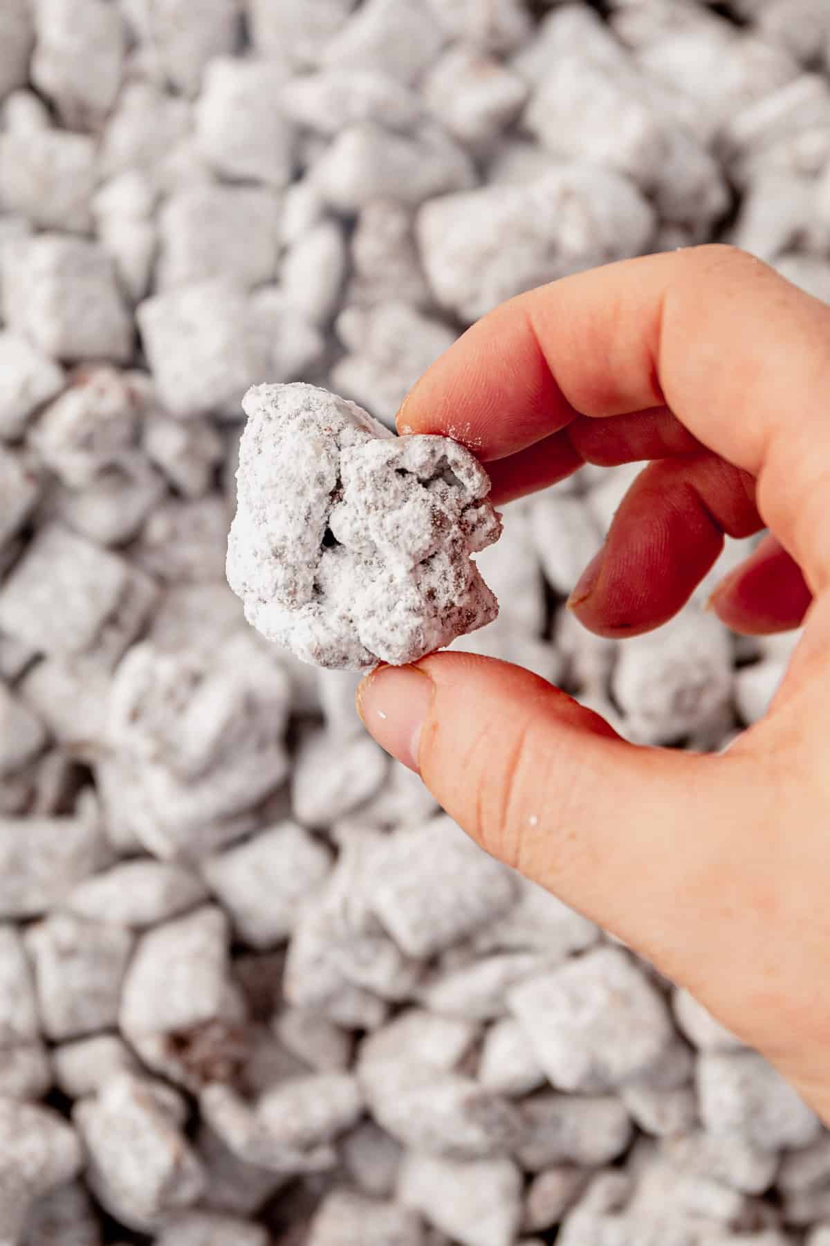 holding a large cluster of puppy chow