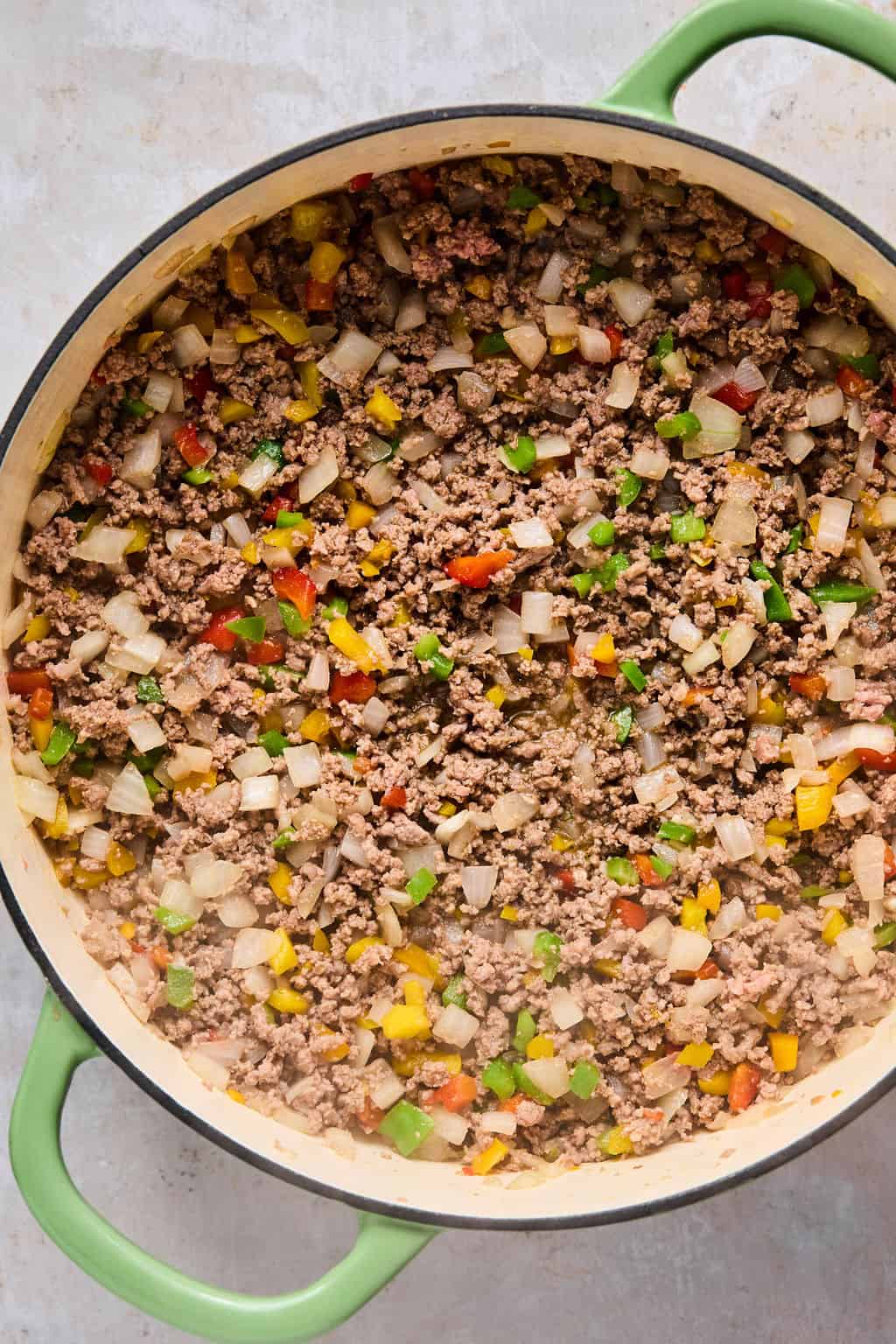 stuffed pepper filling with ground beef in a pan.