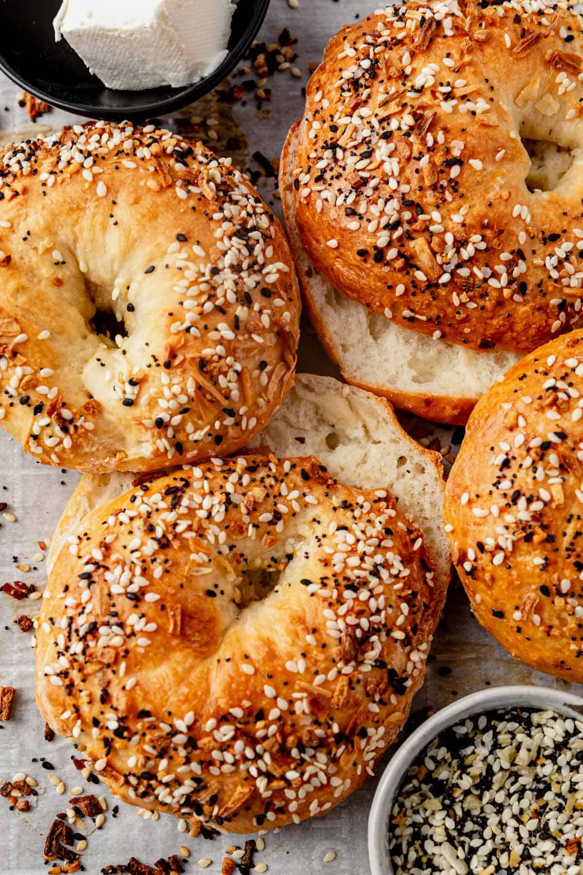 cottage cheese bagels with everything bagel seasoning sliced on a tray