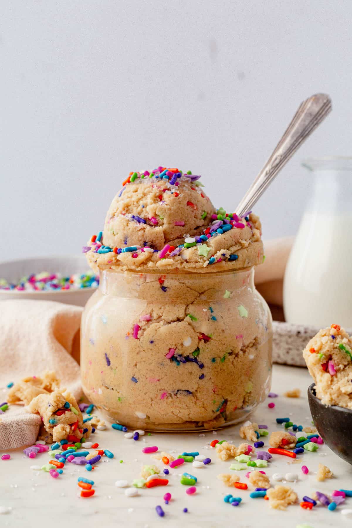 a jar of edible sugar cookie dough with a spoon