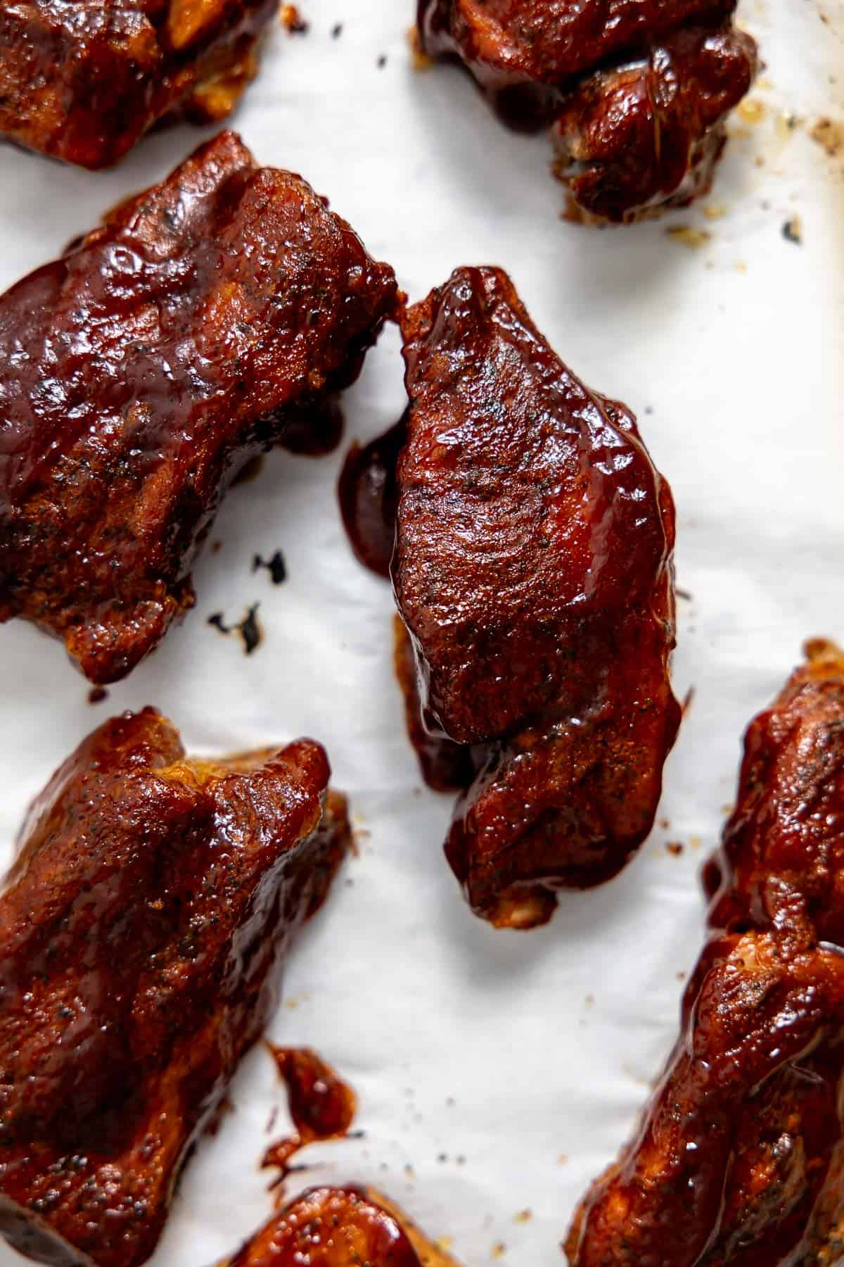 instant pot bbq pork ribs on sheet pan after broiling until bubbly.