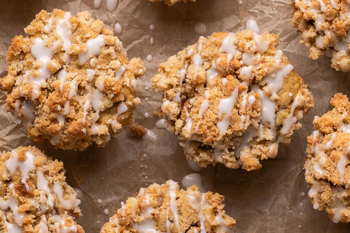 icing drizzled on top of coffee cake muffins