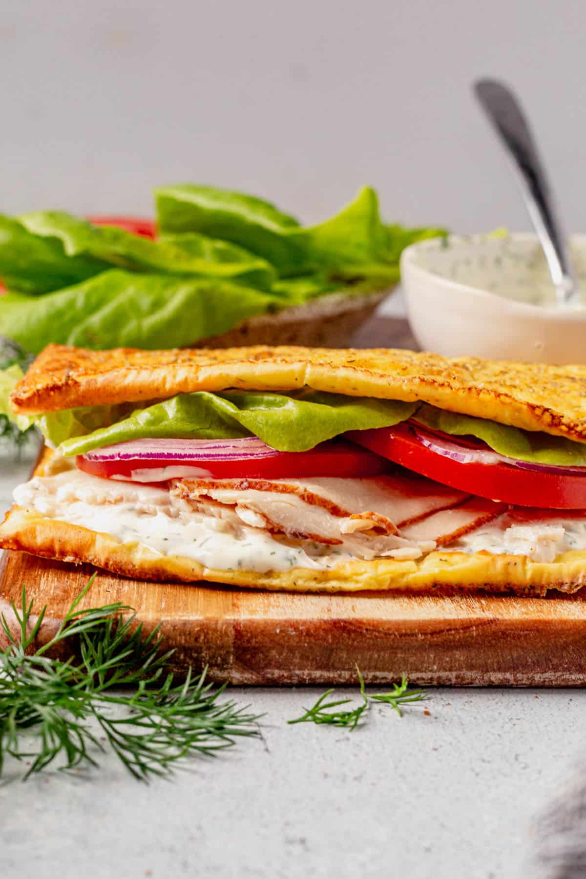 cottage cheese flatbread sandwich on a cutting board