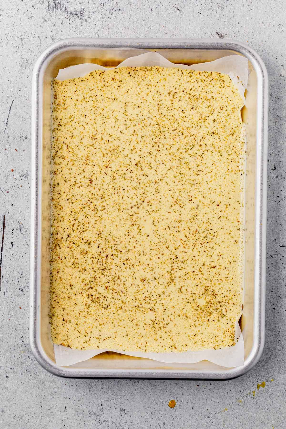 cottage cheese flatbread batter on a sheet pan