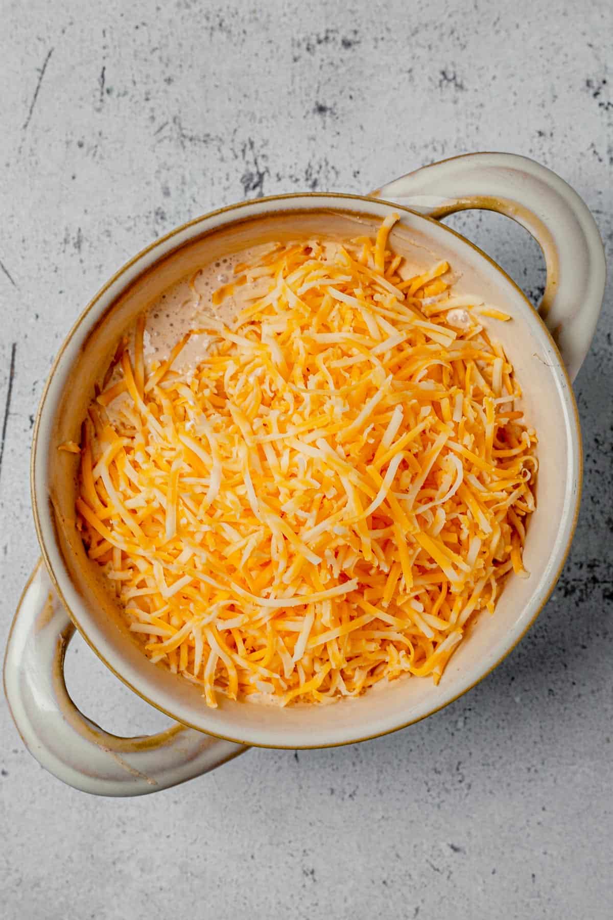 cottage cheese, taco seasoning, and shredded cheese in a bowl