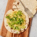 avocado on top of a charred tortilla