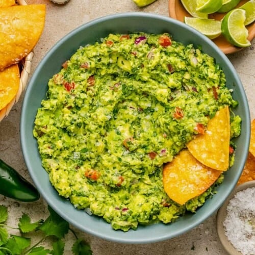homemade guacamole in a serving bowl with tortilla chips