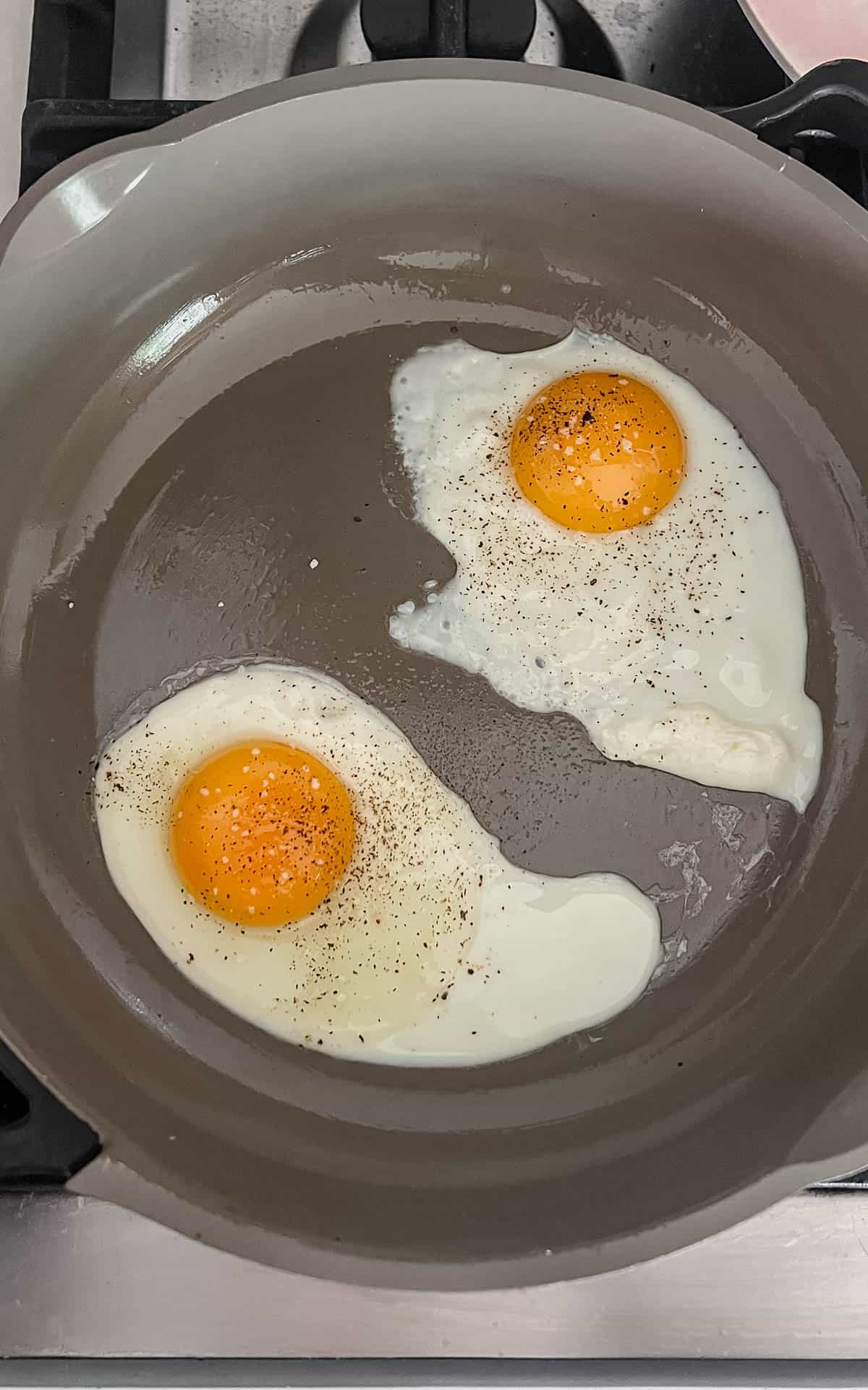 two eggs cracked in a skillet