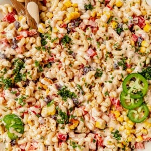 mexican macaroni salad in a bowl with creamy dressing