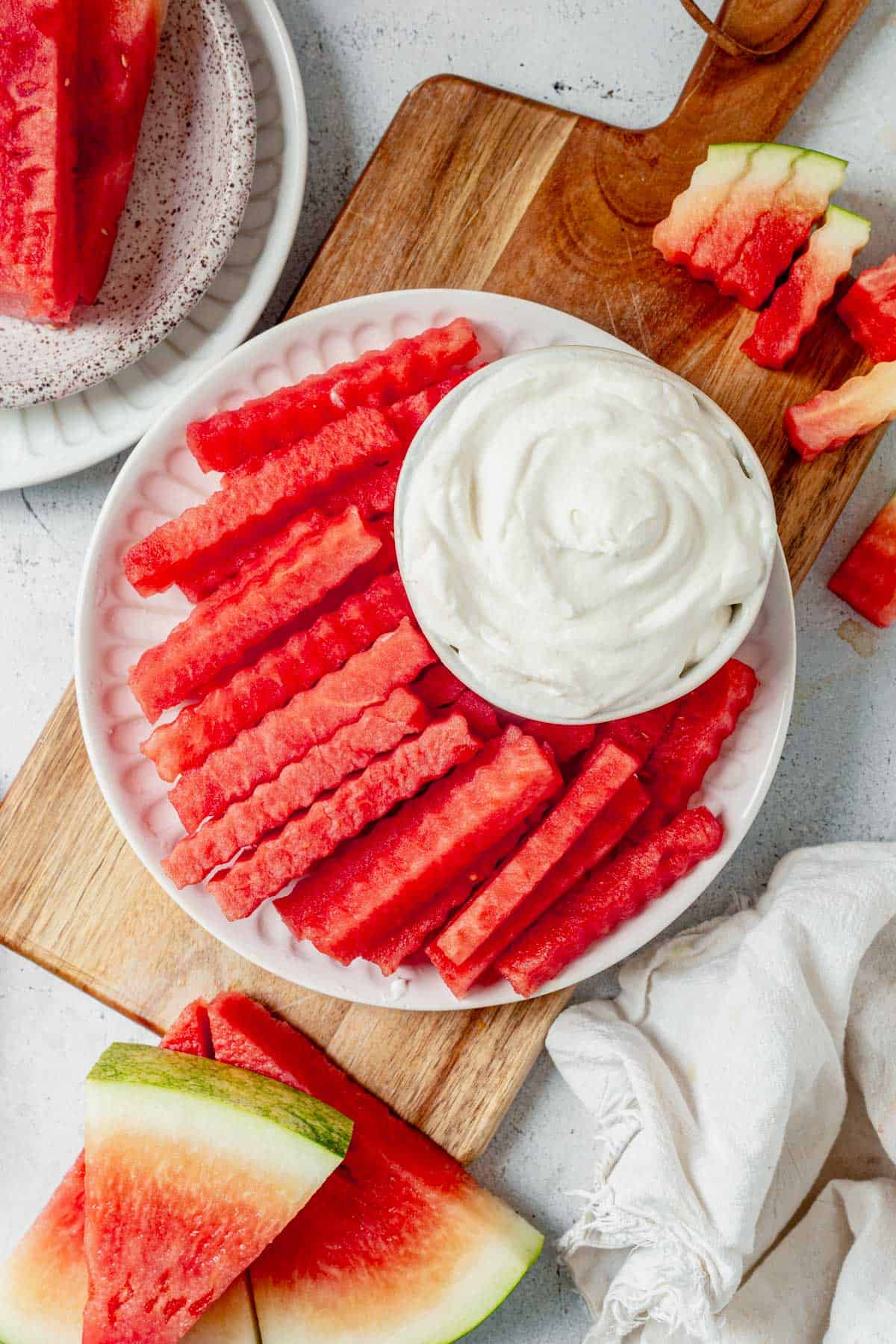 watermelon fries on a plate with whipped yogurt dip