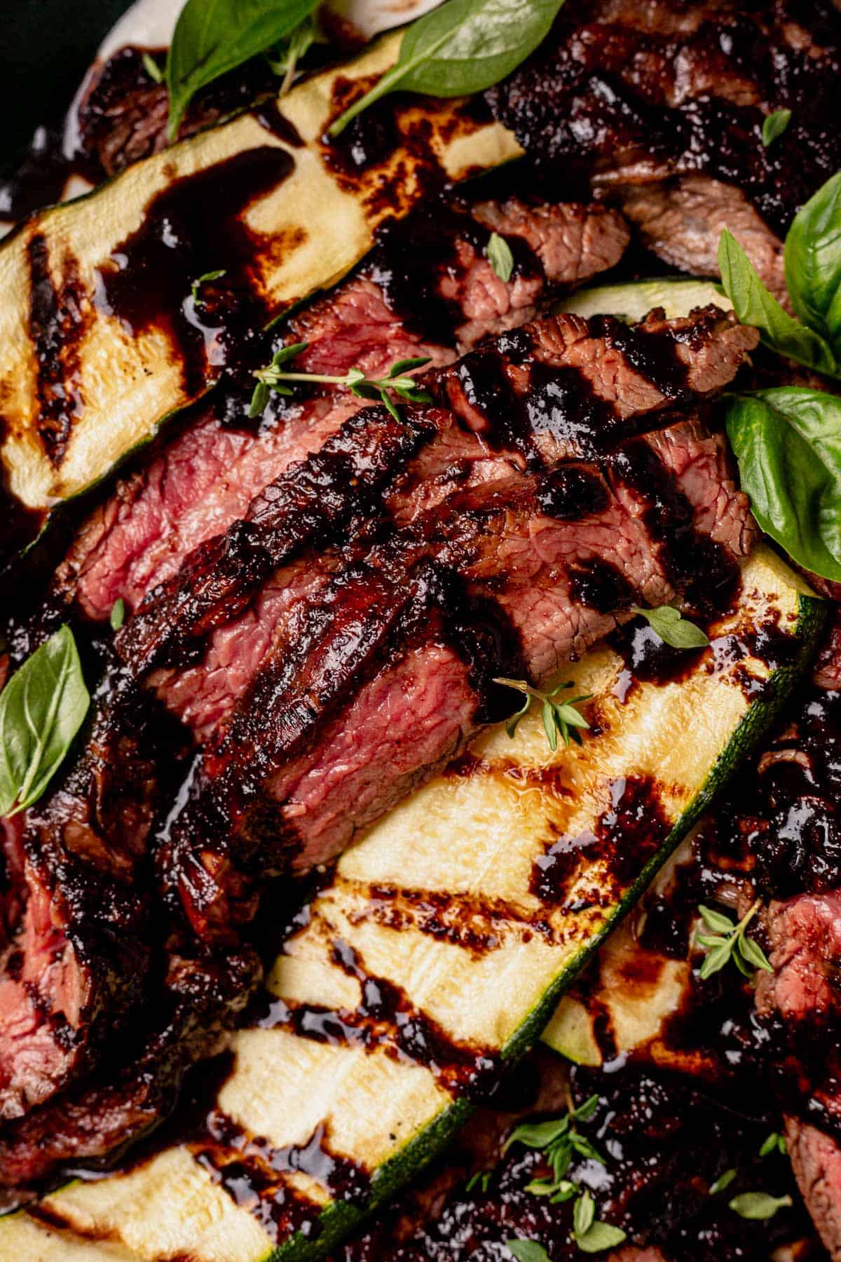 balsamic flank steak served with grilled zucchini and whipped feta