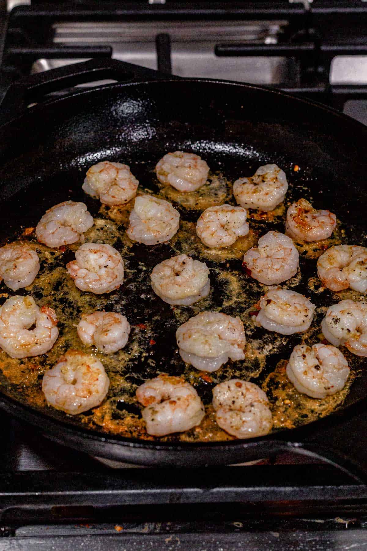 pan seared shrimp in a skillet.