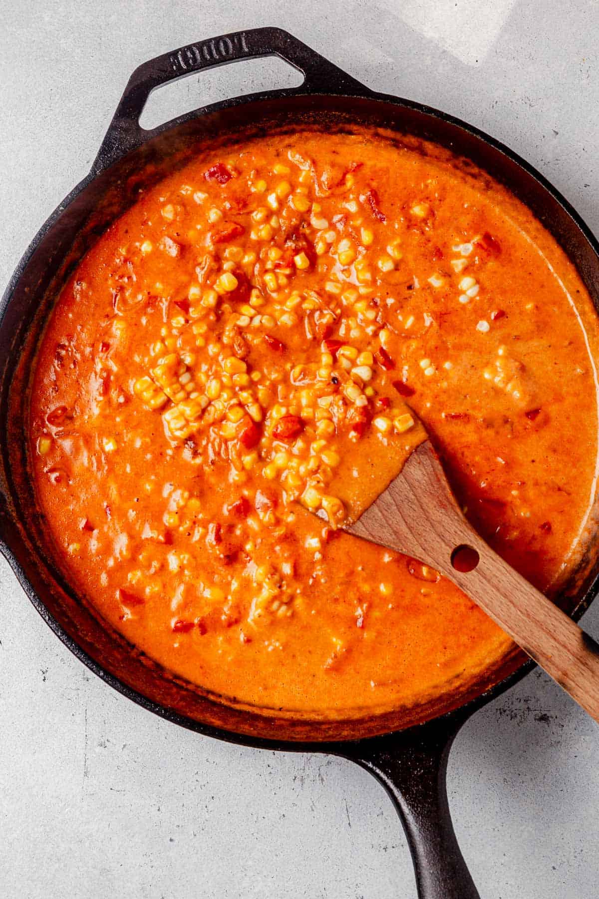 creamy tomato coconut milk sauce in a skillet.