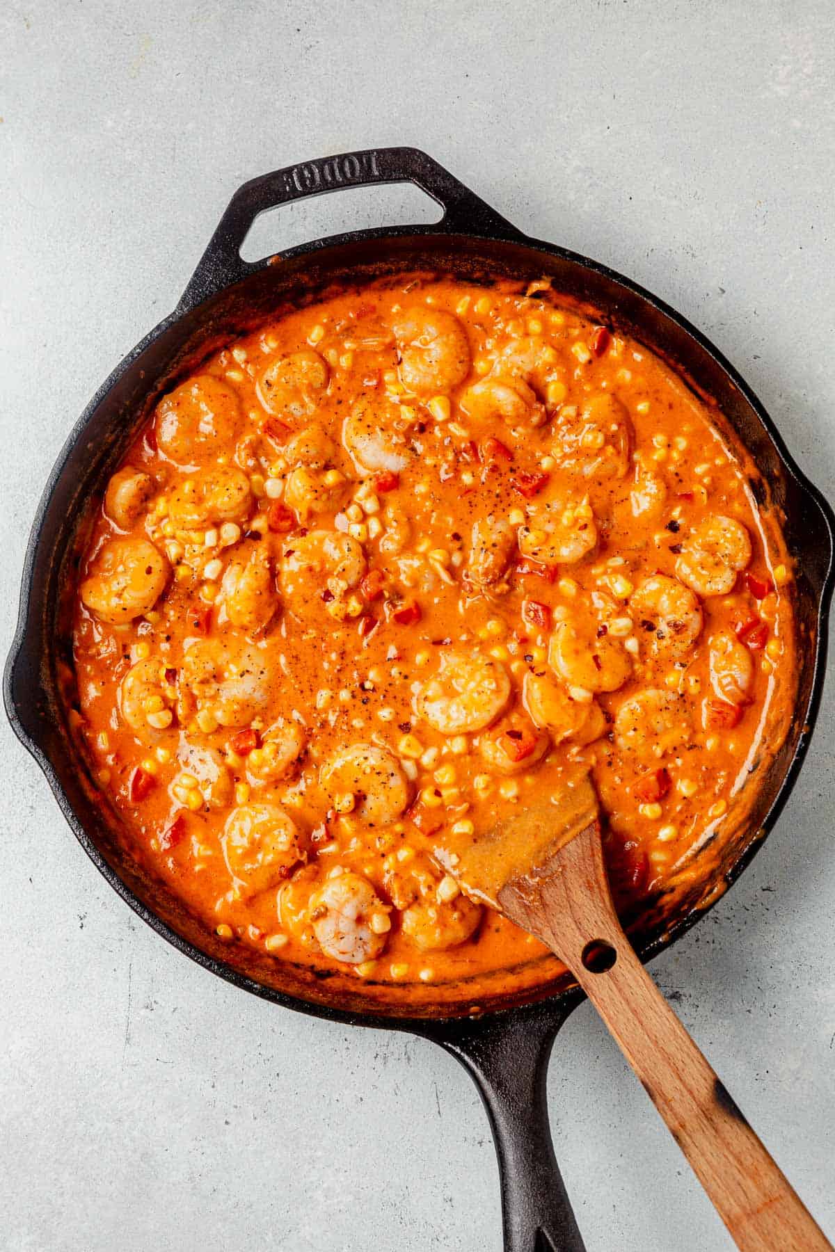 creamy coconut shirimp in a cast iron skillet.