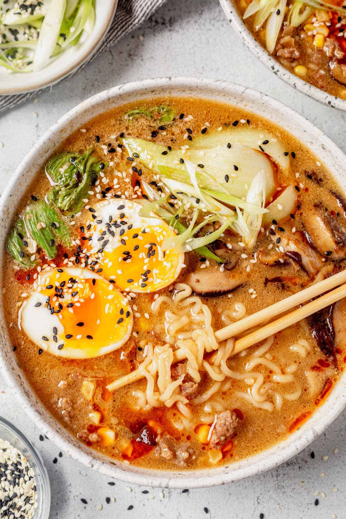 miso pork ramen with soft boiled egg and chopsticks