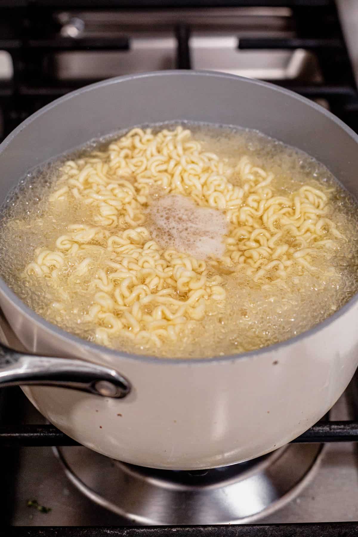 ramen noodles boiling on the stove