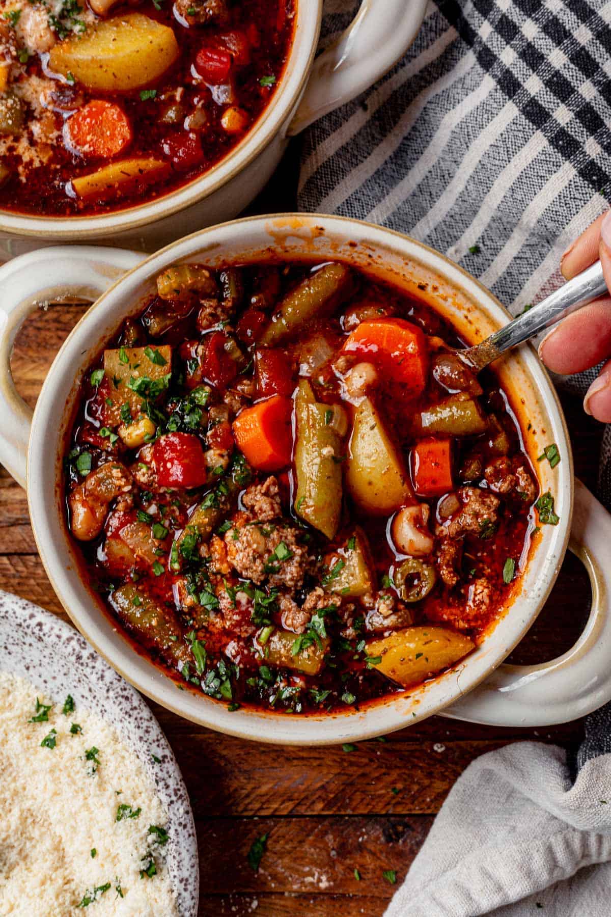 a bowl of cowboy soup in a bowl with a spoon.