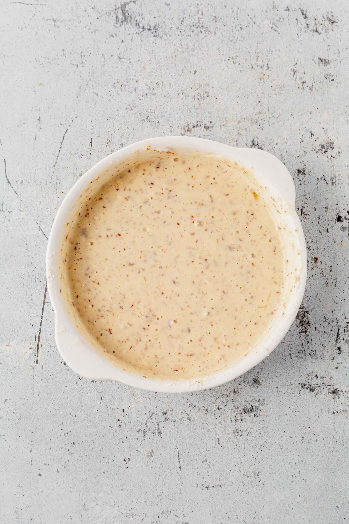 pancake batter in a white ramekin.