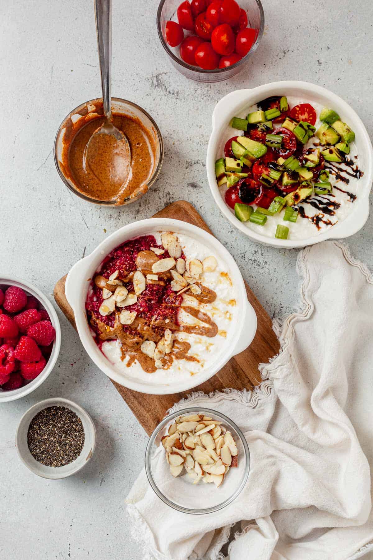 two cottage cheese breakfast bowls on a countertop.