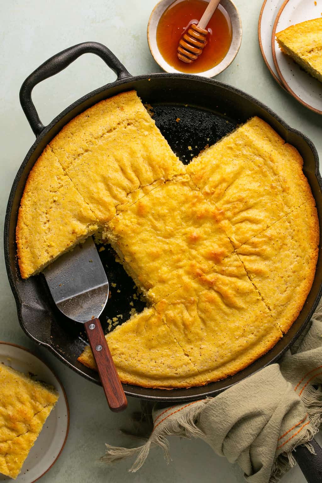 gluten-free cornbread baked on a skillet and cut into squares.