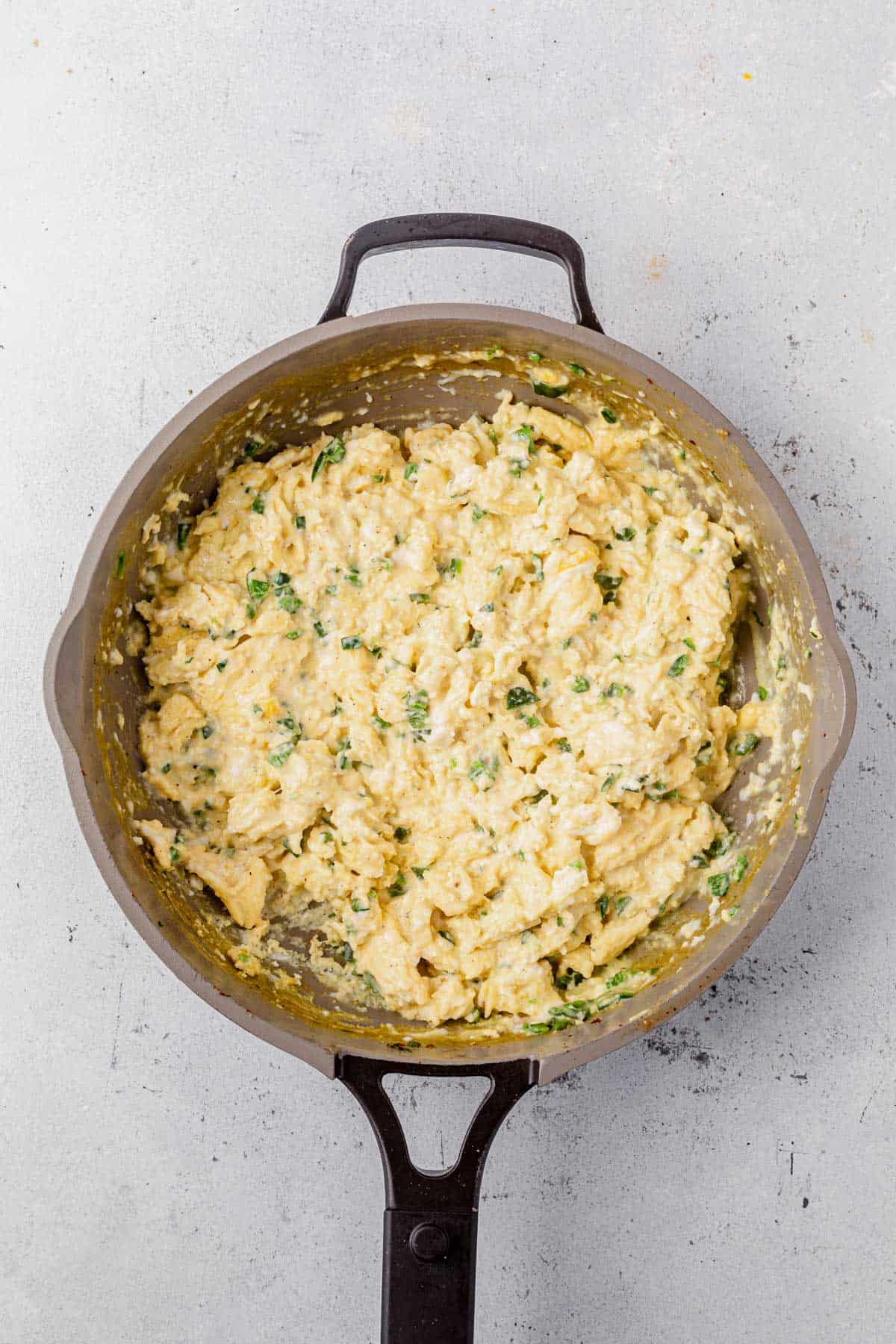 scrambled eggs in a skillet.