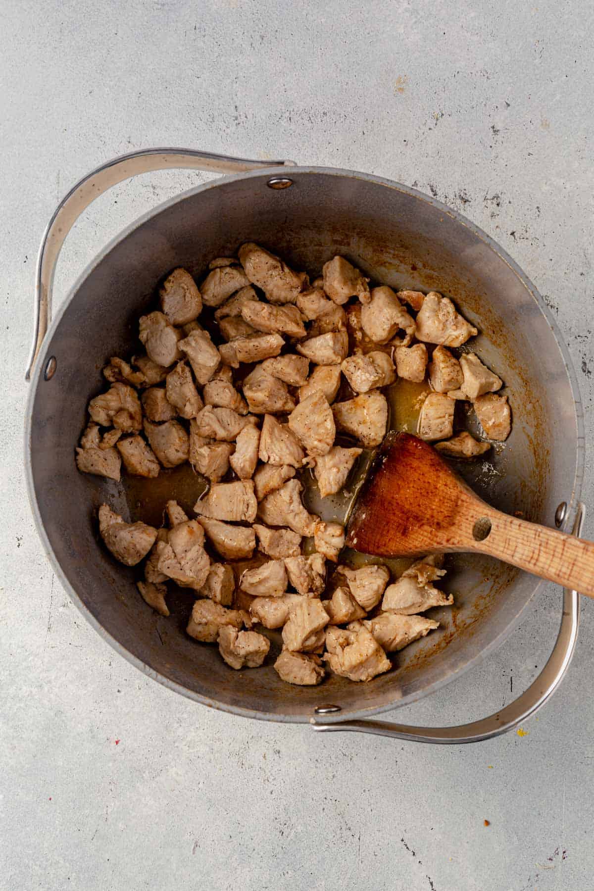 cubed and cooked chicken in a large soup pot.