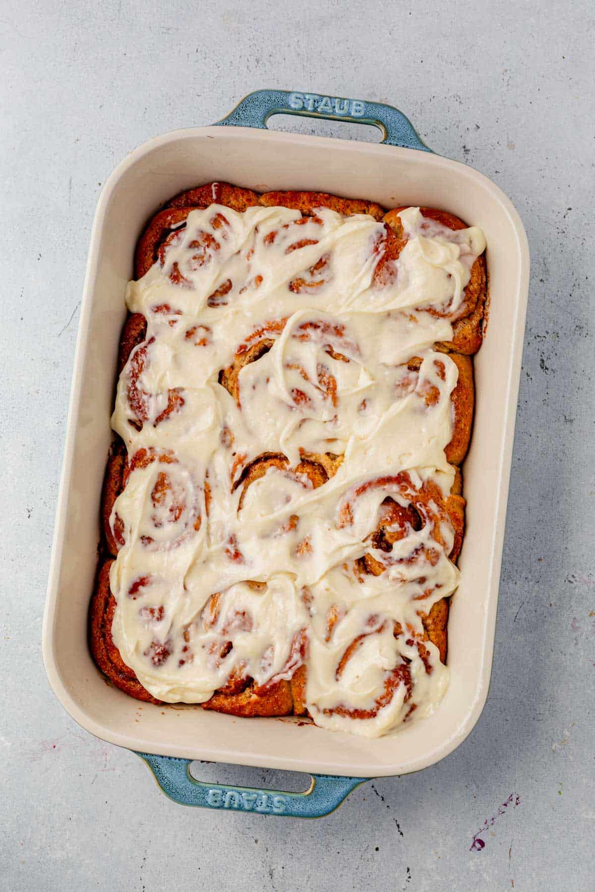 protein cinnamon rolls topped with protein vanilla frosting.