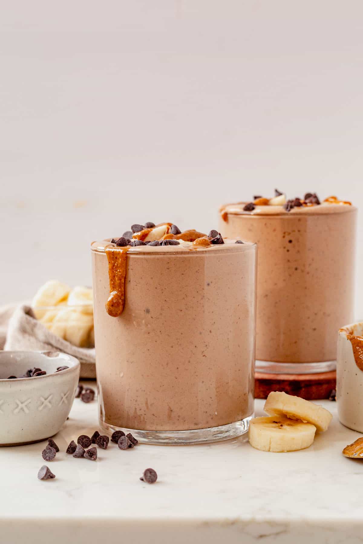 chocolate peanut butter smoothie with protein and topped with peanut butter.