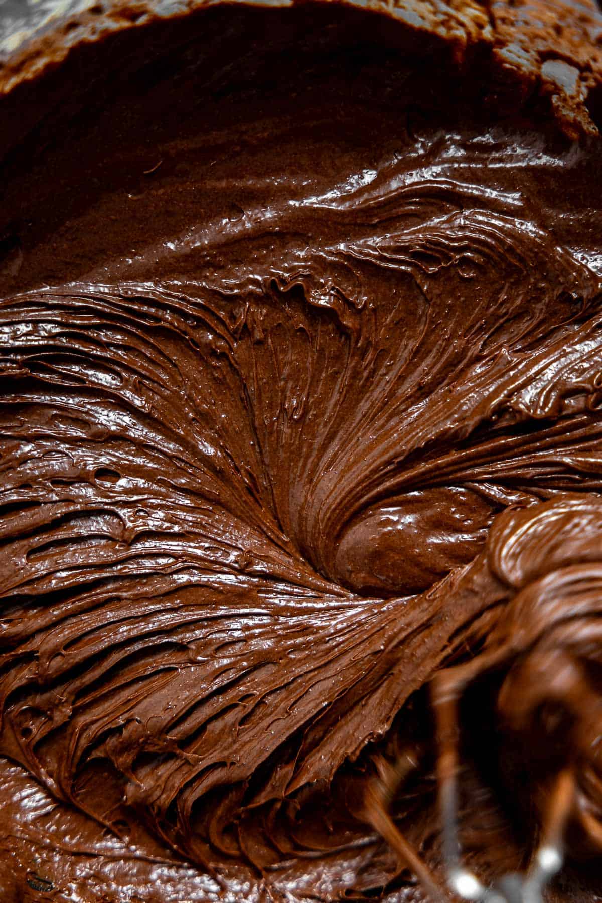 beating cocoa powder into cookie dough.